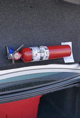 Fire extinguisher in trunk